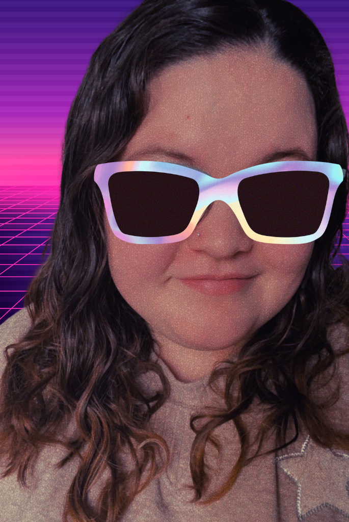 photo of whampaige, a white woman with brown hair. She is wearing a photoshopped pair of sunglasses and is set against a vaporwave background